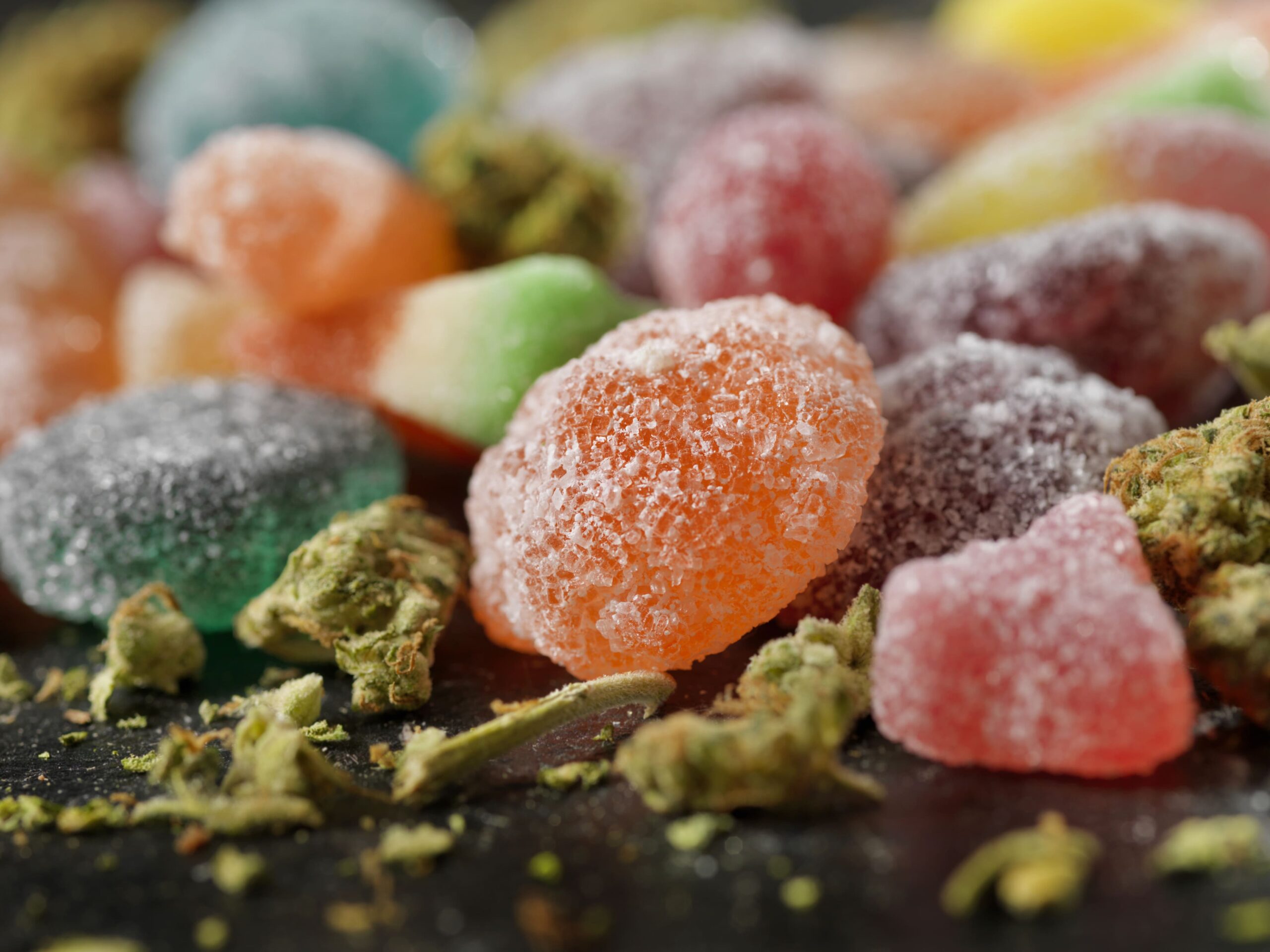 Best Indica edibles in Brampton - assorted cannabis gummies with marijuana buds.