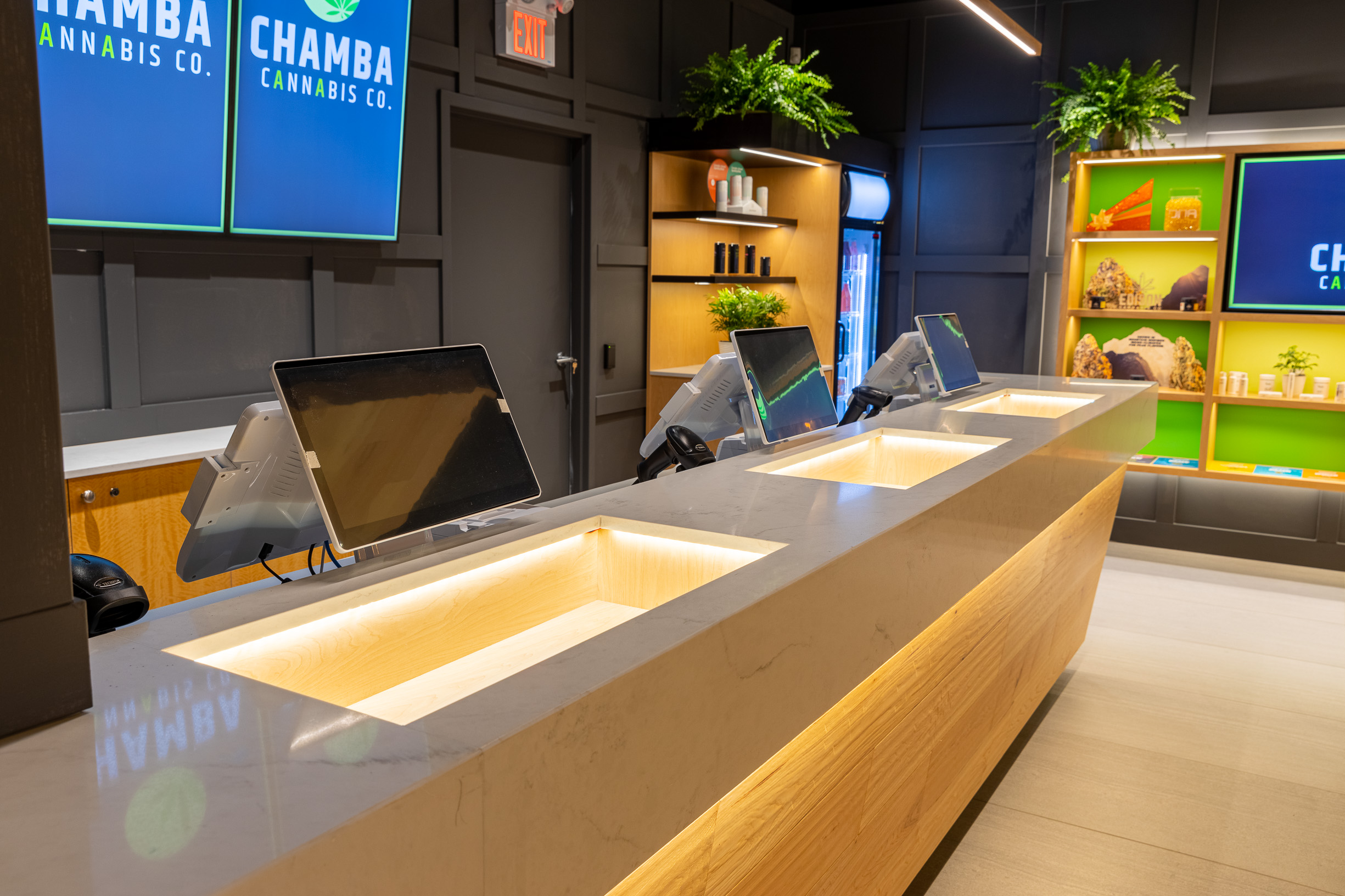 Checkout counter with digital screens at Chamba Cannabis Co. Brampton store, featuring modern cannabis retail setup